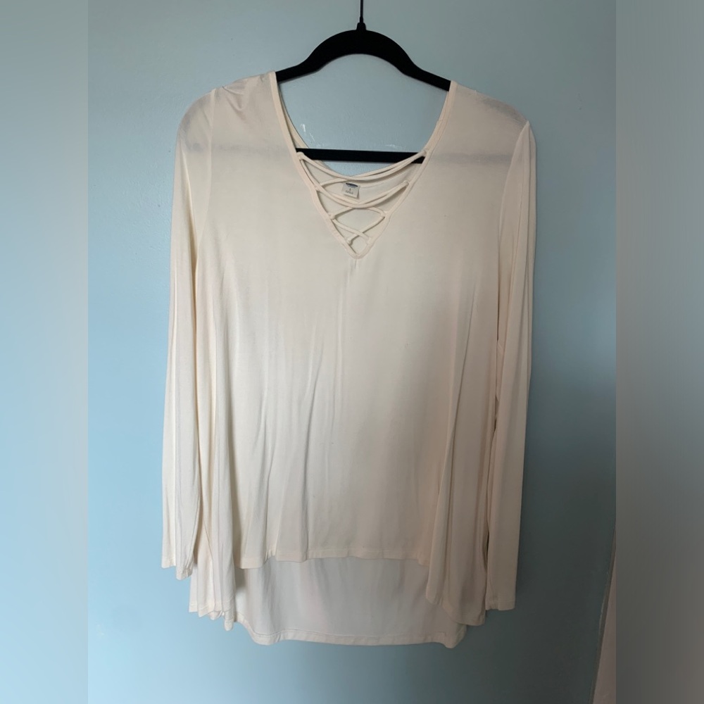 Cream long sleeve shirt with crisscross detail. Size Large
